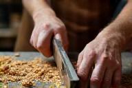 Artisan using hand tools in workshop