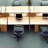 Ergonomic office workspace with custom desks